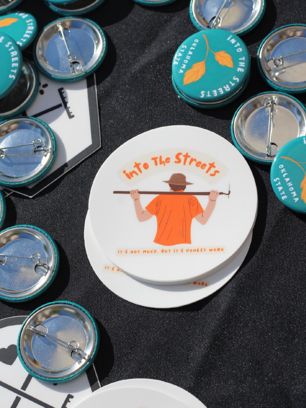 Into the Streets promotional stickers and buttons