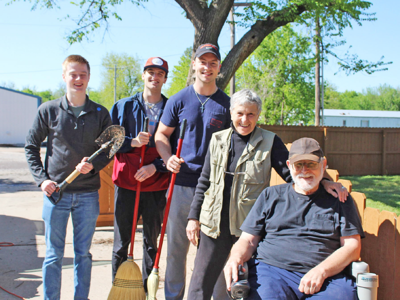 Volunteers smiling with local residents