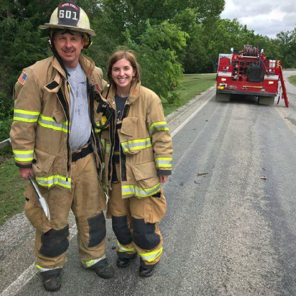 Student helping the Stillwater Firefighters Student helping the Stillwater Firefighters